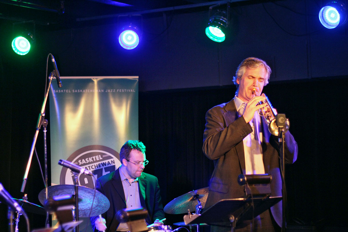 The Story of Jazz. Dean McNeill taking a solo, backed up by Jon McCaslin on drums. Photo taken Tuesday, April 30, 2013.
