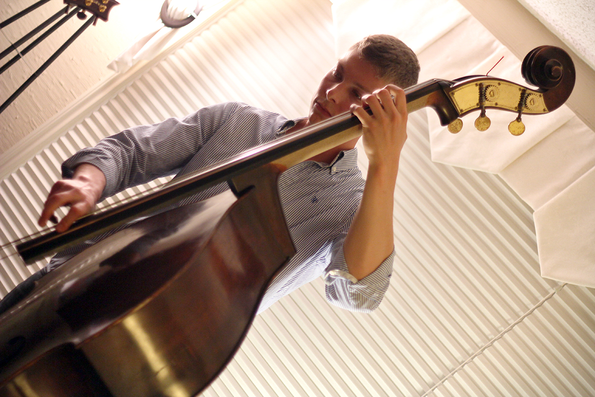 The Soren Nissen, Ian Wright and Nate Renner trio. Nissen takes a solo on his double bass. Photo taken Friday, May 17, 2013.