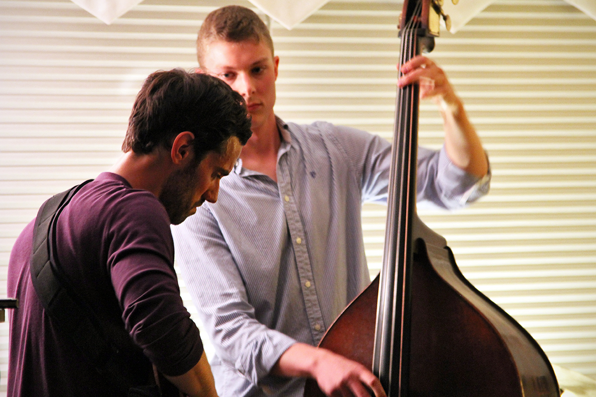 The Soren Nissen, Ian Wright and Nate Renner trio. Renner leans into another guitar solo as Nissen plays on in the background. Photo taken Friday, May 17, 2013.