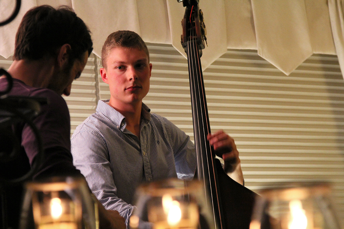 The Soren Nissen, Ian Wright and Nate Renner trio. Renner takes a guitar solo while Nissen looks on. Photo taken Friday, May 17, 2013.