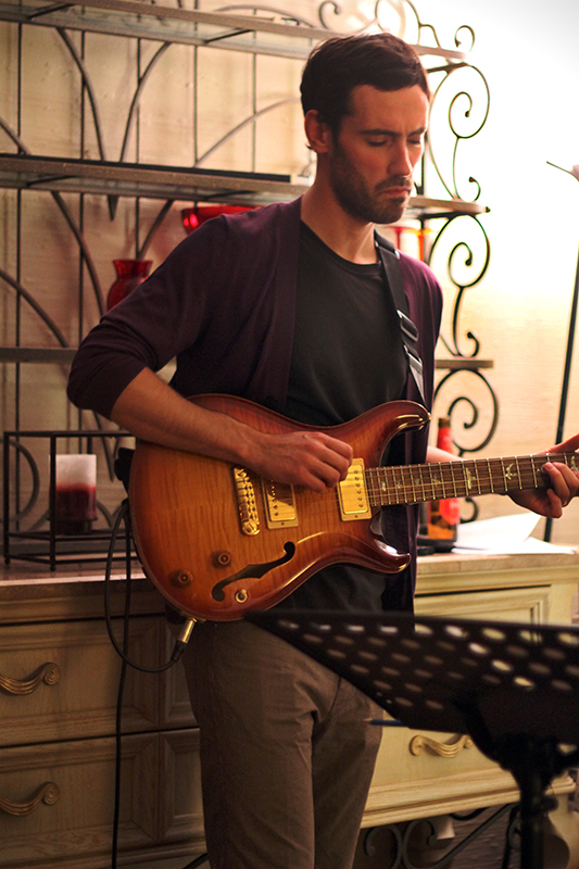 The Soren Nissen, Ian Wright and Nate Renner trio. Guitarist Nate Renner getting into a groove. Photo taken Friday, May 17, 2013.